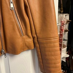 Leather looking jacket.